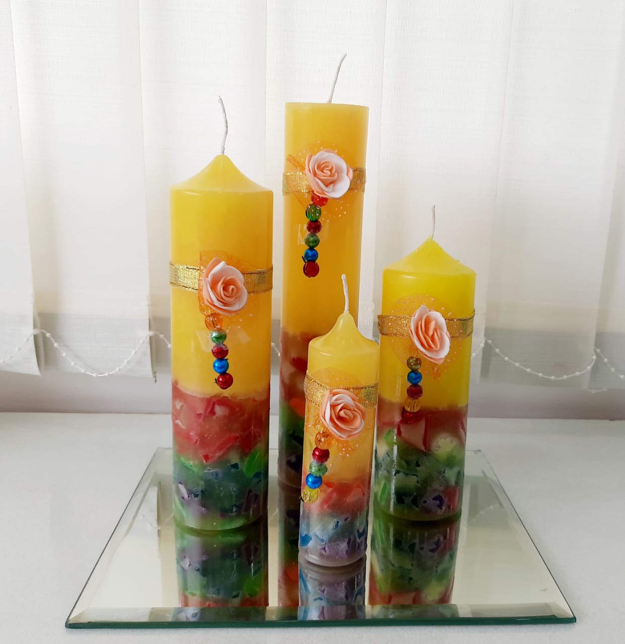 Beautifully hand designed Yellow Multi color pillar candles set of 4 ( Floral Scented)
